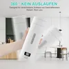 A hand holding a white portable kettle in a modern kitchen setting, with a dining area in the background. Produktbild-Vorschau