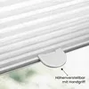 A close-up of a white pleated blind with a height adjustment handle and text indicating it is height-adjustable with a handle. Produktbild-Vorschau