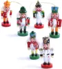 A collection of six small, hand-painted wooden nutcracker ornaments arranged on a white background. Voir les images du produit
