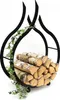 A black metal firewood rack shaped like flames, filled with logs and decorated with ivy. Produktbild-Vorschau