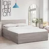 A bedroom scene with a bed, headboard, and pillows. Produktbild-Vorschau