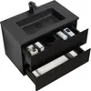 A black bathroom vanity with a sink and two drawers, showcasing some toiletries and towels. Produktbild-Vorschau