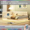 A modern bedroom with a beige upholstered bed featuring LED lighting. Produktbild-Vorschau
