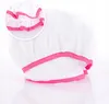A white shower cap with pink trim, shown against a white background. Náhled obrázku produktu
