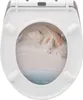 A toilet seat with a printed image of a sandy beach and seashells. Produktbild-Vorschau