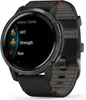 A close-up shot of a Garmin Venu 2 smartwatch with a black band and a dark gray bezel, displaying a menu of activities on its screen. Produktbild-Vorschau