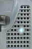 A close-up view of a gray appliance with a blue indicator light and a logo. Produktbild-Vorschau