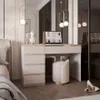 A modern bedroom with a vanity desk, stool, and laptop. Produktbild-Vorschau