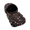 A brown dog bed with a paw print and bone pattern, featuring a hooded top and a separate cushion. Náhľad obrázku produktu