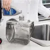 A person is pouring cleaning solution from a bottle into a transparent tank of a cleaning machine. Voir les images du produit