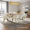 A dining room with a table and chairs, set for a meal. Produktbild-Vorschau