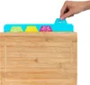 A hand is shown placing a cutting board mat onto a bamboo cutting board. Anteprima dell’immagine prodotto