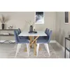 A dining room setting with a white table and blue chairs. Produktbild-Vorschau