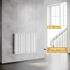 A white radiator mounted on a tiled wall in a modern bathroom setting, with a close-up inset showing product details. Anteprima dell’immagine prodotto