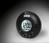 A black digital alarm clock with a round shape and a digital display showing the time. Produktbild-Vorschau
