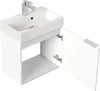 A white bathroom vanity with a sink and faucet, with one door open. Produktbild-Vorschau