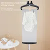 A baby bodysuit is being steamed on a garment steamer, with text promoting its refreshing and sanitizing steam power. Produktbild-Vorschau