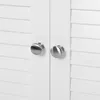 A close-up view of two silver knobs on a white cabinet with louvered doors. Produktbild-Vorschau