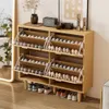 A wooden shoe cabinet filled with shoes, placed indoors. Podgląd zdjęcia produktu