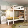 A child's bedroom with a bunk bed, storage unit, and toys on the floor. Anteprima dell’immagine prodotto