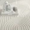A white tray with a lantern, a candle, and a decorative apple sits on a textured white rug with a geometric pattern. Anteprima dell’immagine prodotto