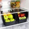 Inside a refrigerator, showing two black storage bins filled with fruits and vegetables. Náhled obrázku produktu