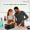 A couple is in a kitchen preparing food. The woman is reaching into a black potato storage box, and the man is slicing vegetables on a cutting board. Produktbild-Vorschau