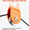 Close-up of an orange pulley with a black cable running through it. Náhled obrázku produktu