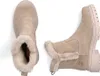 A pair of beige winter boots with faux fur trim, shown from a top-down and side view. Voir les images du produit