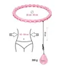 Diagram showing a hula hoop with measurements and a diagram of a person's waist. Podgląd zdjęcia produktu