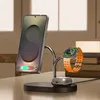 A wireless charging stand with a phone and a smartwatch on it. Podgląd zdjęcia produktu