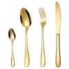 A set of four gold-colored cutlery items arranged in a line against a white background. Anteprima dell’immagine prodotto