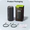Product packaging with a speaker, cables, and manual. Produktbild-Vorschau