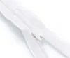 A close-up shot of a white zipper on a white background. Produktbild-Vorschau