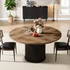 A round dining table with chairs in a dining room setting. Produktbild-Vorschau
