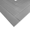 A close-up, angled view of gray, rectangular panels arranged in a herringbone pattern. Podgląd zdjęcia produktu