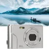A digital camera is shown in the foreground, with a scenic landscape in the background. Produktbild-Vorschau