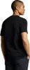A man wearing a black t-shirt and patterned pants, shown from the back and side. Produktbild-Vorschau