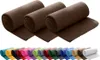 Three rolled-up brown fleece blankets are displayed prominently in the upper portion of the image, with a colorful array of rolled blankets shown below. Náhľad obrázku produktu