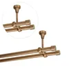 A close-up view of a double curtain rod system mounted to a ceiling. Anteprima dell’immagine prodotto