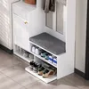 A white entryway organizer with a shoe bench, storage cabinet, and hooks. Voir les images du produit