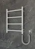 A white electric towel radiator mounted on a dark gray marble-patterned wall, with a coiled power cord plugged into a wall socket. Náhled obrázku produktu