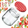 A glass jar and its lid are shown with various vegetables and herbs arranged around them. Voir les images du produit