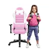 A young girl stands next to a pink gaming chair, wearing a backpack and headphones. Produktbild-Vorschau