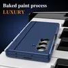 A blue phone case is placed on a surface resembling piano keys, with text overlays indicating 'Baked paint process' and 'LUXURY'. Anteprima dell’immagine prodotto