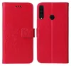 A red flip phone case with floral and butterfly embossing is shown open, displaying the inside and outside. Produktbild-Vorschau