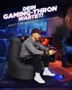 A man is playing a video game while sitting on a large black beanbag chair in a dimly lit room with neon blue lighting. Produktbild-Vorschau