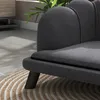 A close-up view of a dark gray pet sofa with wooden legs resting on a circular rug. Podgląd zdjęcia produktu