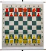 A chess board with red and yellow pieces set up for a game. Voir les images du produit