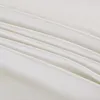 A close-up view of white fabric with soft folds and creases, suggesting a textile product like bedding. Produktbild-Vorschau